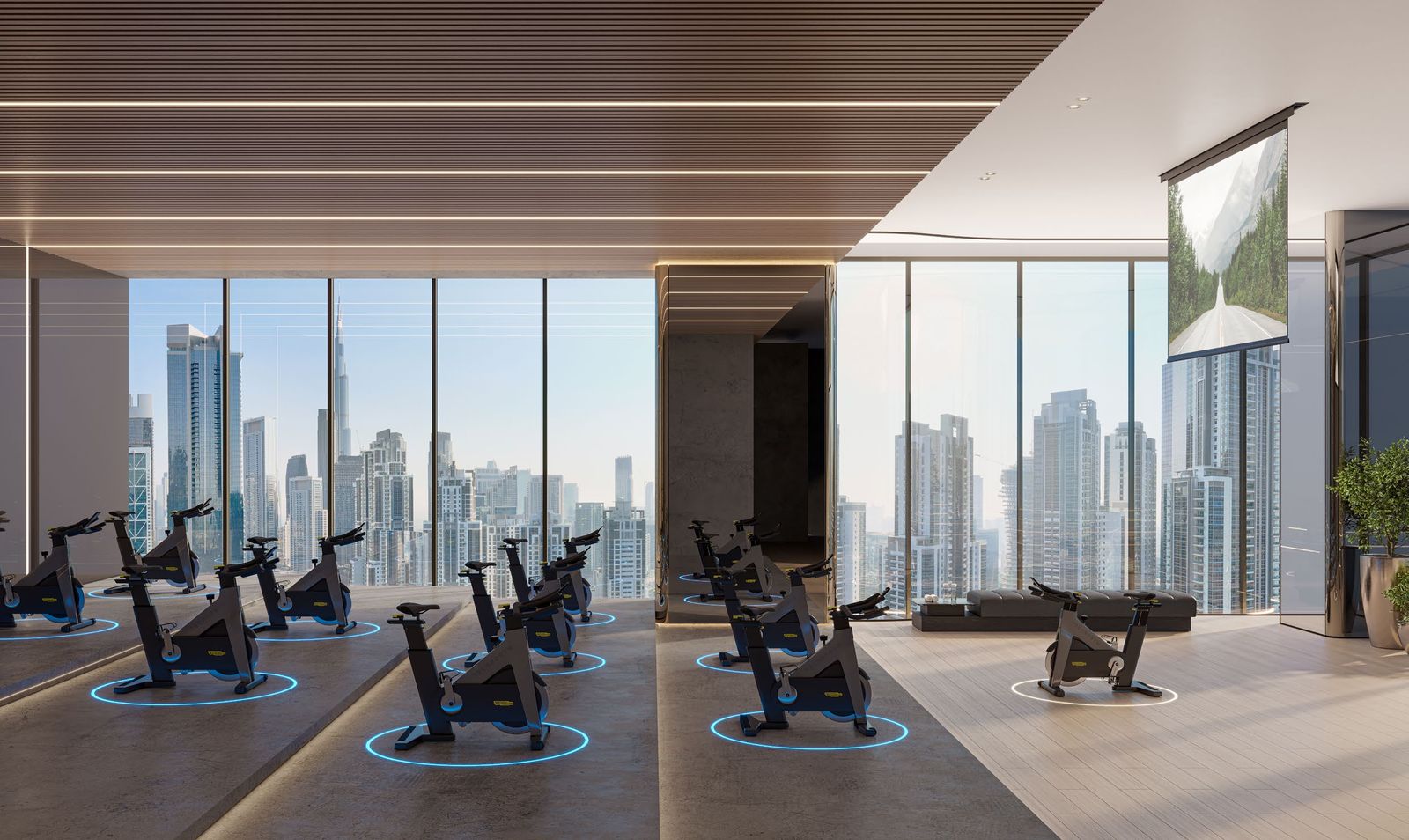 Spinning studio with bikes facing the Business Bay skyline at Berkeley Tower